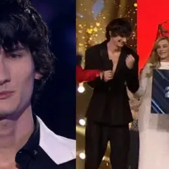 Dominik, zwycięzca Top Model, odbiera czek na 200 000 PLN.