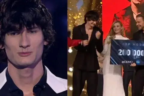 Dominik, zwycięzca Top Model, odbiera czek na 200 000 PLN.