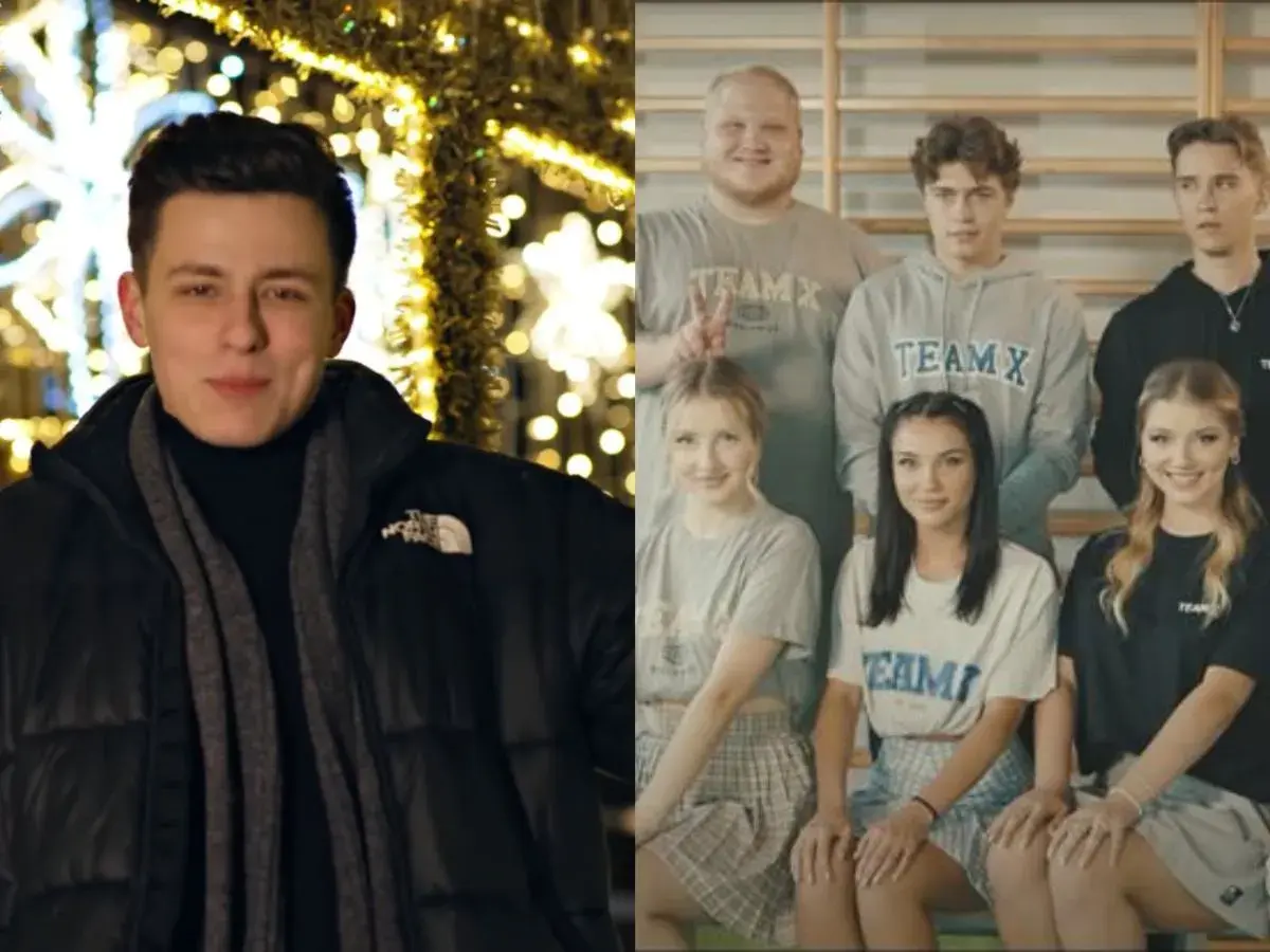 Młody mężczyzna przed świątecznymi iluminacjami i grupa osób w strojach z napisem TEAM X, jakby po obozie.